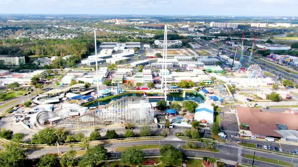 Sleeping massive amusement park during daylight, aerial side fly view alt