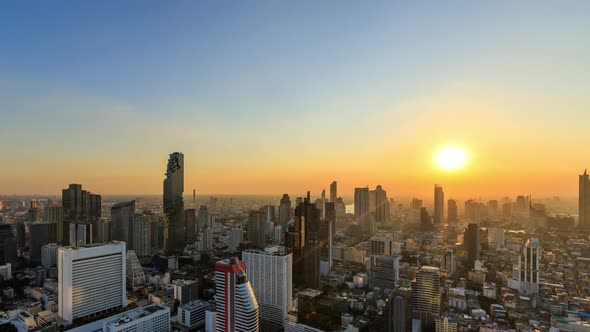 Bangkok business district city center above Silom area, day to night; zoom in – Time Lapse