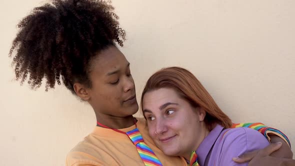 Multiracial lesbian couple having tender moment