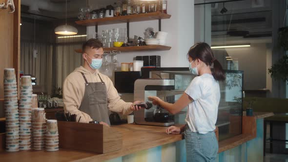 Asian Man in Medical Face Mask in Coffee Shop Lockdown Quarantine Coronavirus is Over Back to Normal alt