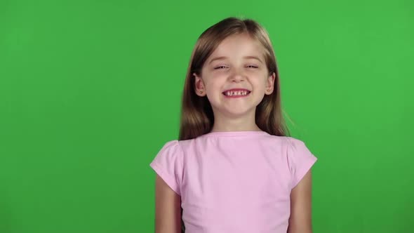 Child Genuinely Smile at the Camera. Green Screen. Slow Motion alt