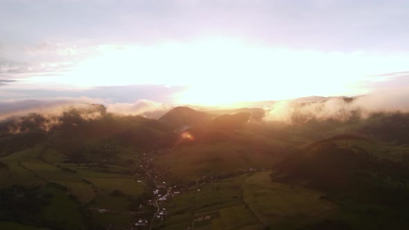 Aerial View of Sunset in Rural Hilly Landscape