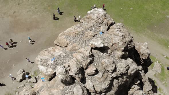 Tourists Religious Symbol Taikhar Chuluu Rock in Arkhangai Aimag, Mongolia alt
