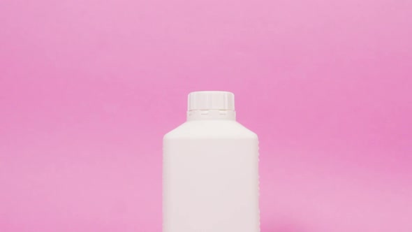 A Square White Bottle Made of Recycled Plastic with Household Chemicals