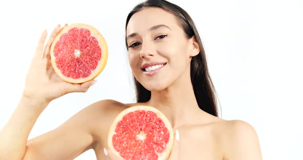 Woman with Grapefruit Isolated on White