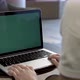 Businesswoman Looking At Green Screen Of Laptop - VideoHive Item for Sale