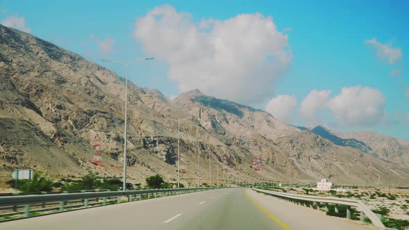 Riding a Car in Oman. First View Perspective Through Wind Screen
