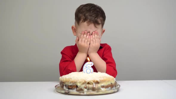 a Little Happy Boy Closed His Eyes To Ask Wishes for His Birthday