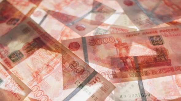 The national Russian currency is rubles, in five-thousand-dollar bills. Top view of a lot of cash. alt