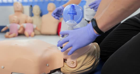 CPR Training Using and an AED and Bag Mask Valve on an Adult Training Manikin alt