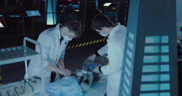 Young Scientists are Doing Artificial Respiration Alien on the Operating Table