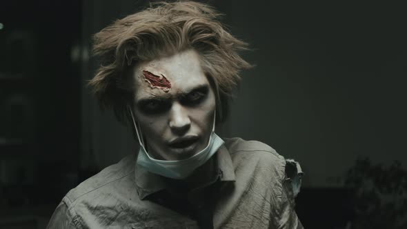 Mindless Zombie Putting on Face Mask in Dark Office alt