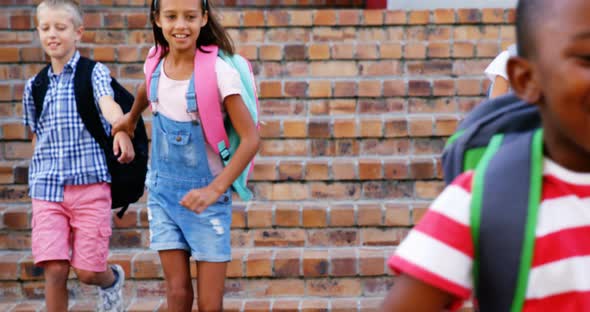 Group of Kids Getting Down from Staircase alt