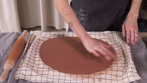 Potter Sculpts Dishes From Clay