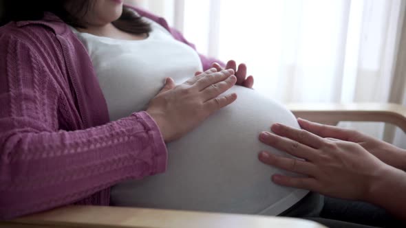 Pregnant Couple Feels Love and Relax at Home alt