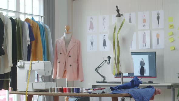 A Mannequin With Tape Measure Is In The Designer Studio alt