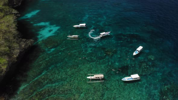 Aerial Drone Flight Over Yacht Sailing From Rocky Bay Bali Indonesia alt