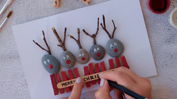 Making Diy Merry Christmas Deer on Greeting Card Postcard Made of Pebbles Sea Stones Clothespins and alt