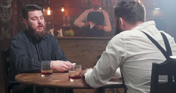 Bearded Men Dealing the Playing Cards alt