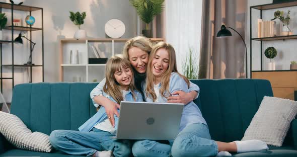 Pretty Loving Caring Mother Approaching to Her Eldest and Younger Daughters alt