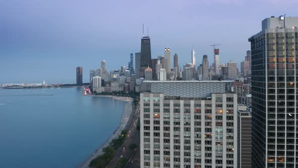 Chicago Aerial Shot with Busy Road and Modern Waterfront Skyscraper Buildings alt