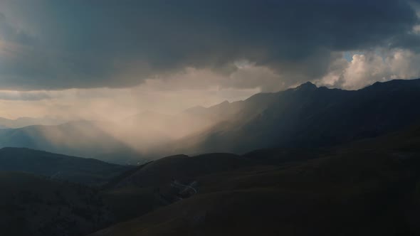 Aerial View of sunset mountain in Abruzzo, with amazing light with clouds, Italy 4K