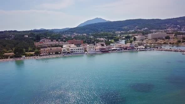 Greece, Corfu Island, drone footage of Messonghi Beach, Moraitika. Flying sideways facing the beach. alt