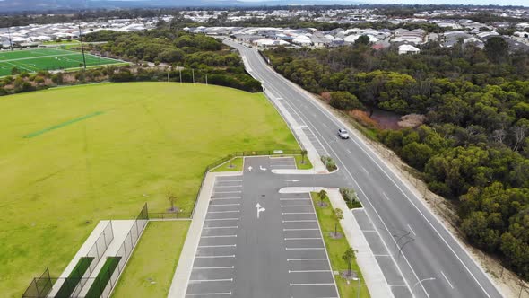 Aerial View of a Car Park near a Oval Field in Australia