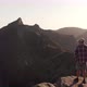 Man Hiker Standing on the Edge of a Cliff in the Mountains of Madeira island, Portugal - VideoHive Item for Sale