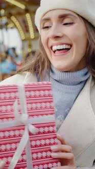 Video of two women walking and browsing Christmas market stalls alt