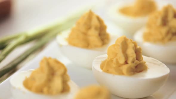 Time lapse. Preparing deviled eggs with organic eggs for appetizer. Step by step recipe. alt