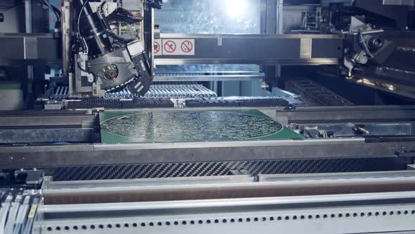 Surface Mount Technology SMT Machine places components on a circuit board