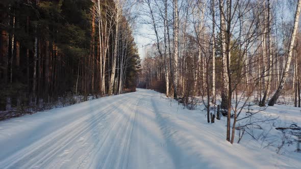 Driving on empty winter road, going forward