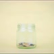 Stop motion animation coin into a clear glass jar on yellow background - VideoHive Item for Sale