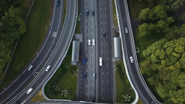 Aerial View Flying Over of Loaded Cars with Traffic Jam at Rush Hour on Highway with Bridge