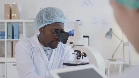 Two Diverse Researchers Working Together alt