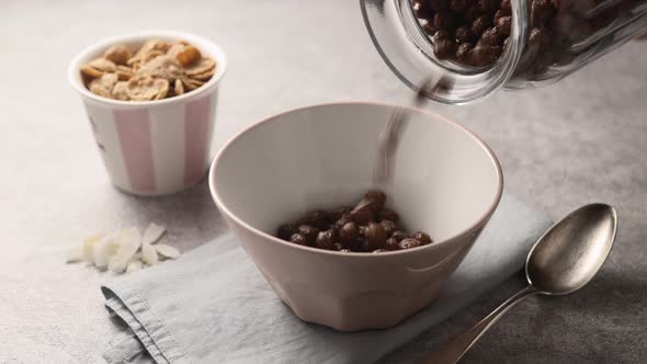 Dry chocolate cereal breakfast in a white bowl