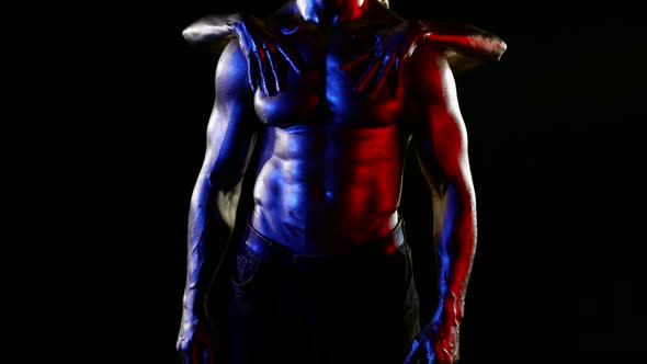 Woman is Stroking Sexy Washboard Abs and Muscular Chest of Attractive Man in Darkness alt