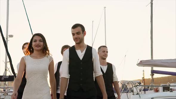 Dream Team Walking Outdoor at Sunset alt