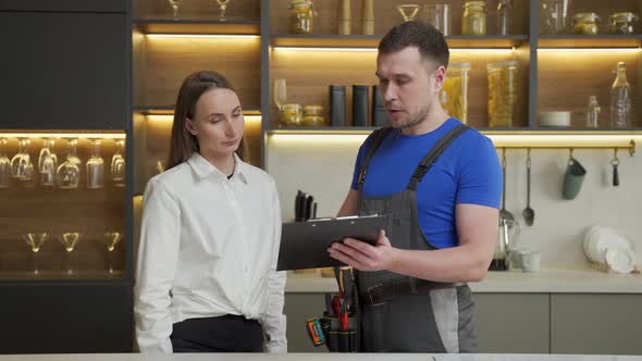 Housewife Signs Form to Use Services of Professional Foreman alt