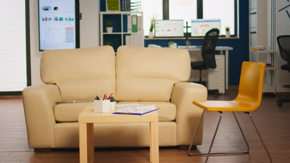 Modern Business Relax Zone Interior with Confortable Couch alt