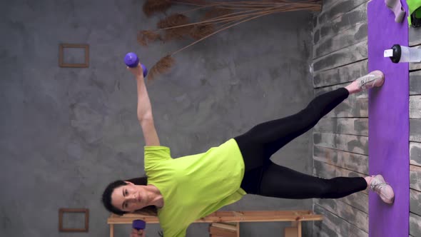 Fitness Woman Lifting Dumbbells for Biceps Workout at Home alt