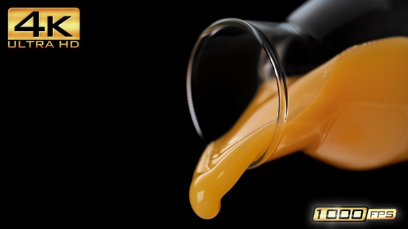 Pouring Orange Juice out of a Bottle alt