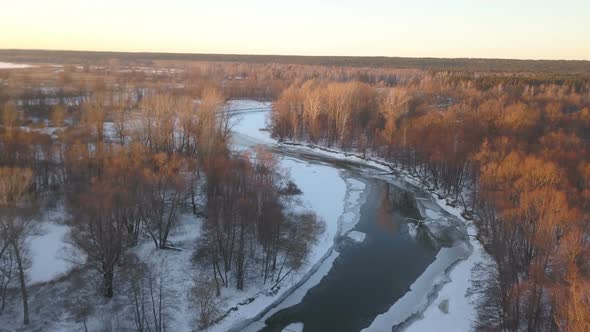 Frozen River In The Winter Forest