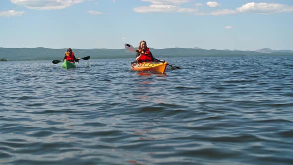 Couple of Tourists on Kayaks alt