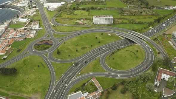 Aerial establihsing shot of the Ribeira Grande Roads in Ponta Delgada, Azores alt