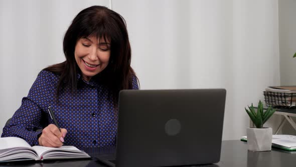 Company Manager Listens Businesswoman Online Video Call Webcam Laptop in Office alt