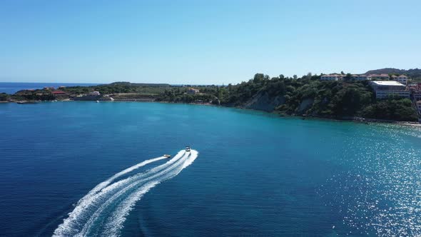 Aerial View of a Motor Boat Towing a Tube. Zakynthos, Greece