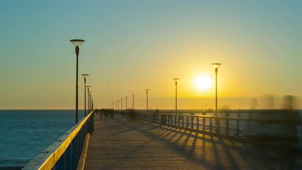 Sunset on the pier in Palanga, Lithuania, time-lapse alt