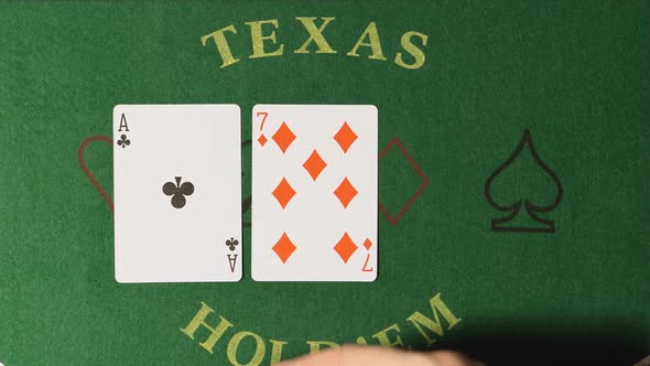 Poker - Dealer hands out cards on a green table